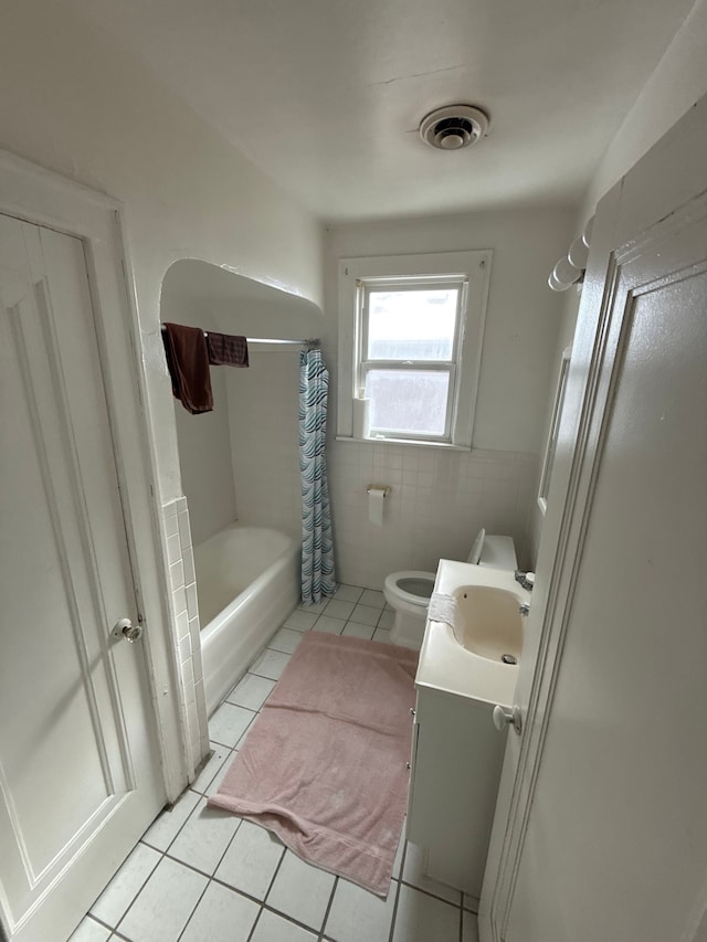 full bathroom with vanity, visible vents, tile patterned floors, toilet, and tile walls