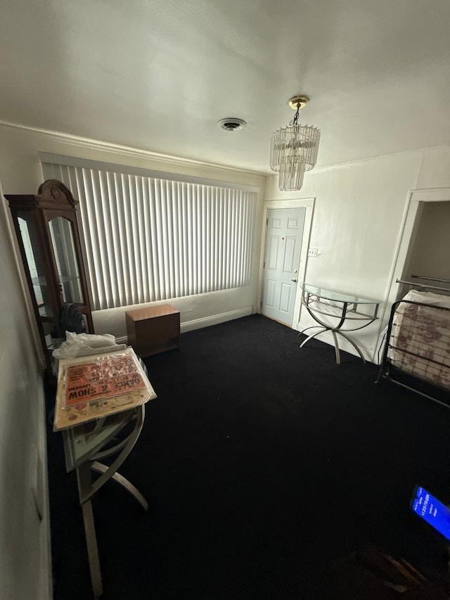 living area featuring a chandelier, visible vents, and dark carpet