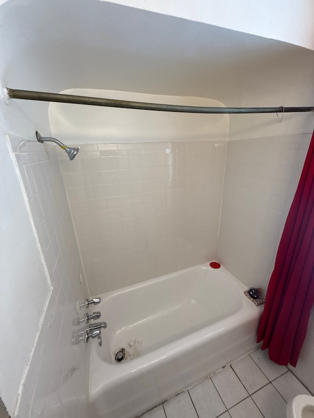 bathroom featuring shower / tub combo with curtain and tile patterned flooring