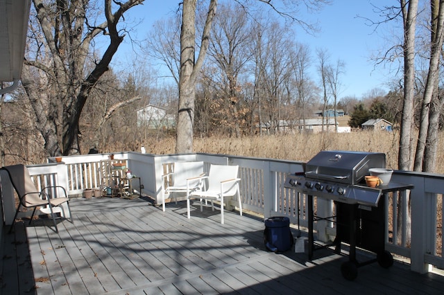 wooden deck featuring area for grilling