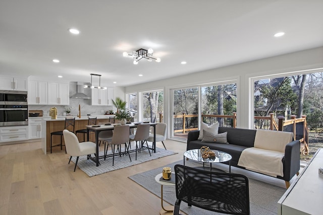 living area featuring recessed lighting and light wood-type flooring