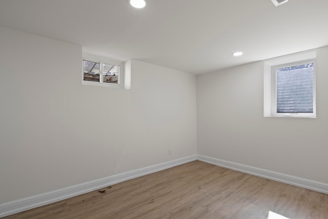 basement featuring visible vents, recessed lighting, baseboards, and wood finished floors