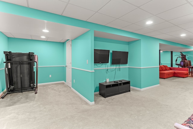 interior space featuring a drop ceiling, recessed lighting, baseboards, and carpet floors