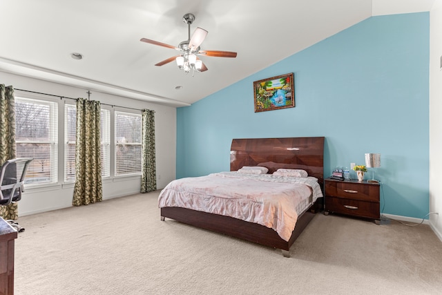 carpeted bedroom with baseboards, a ceiling fan, and vaulted ceiling