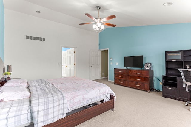 bedroom with visible vents, light carpet, high vaulted ceiling, and ceiling fan