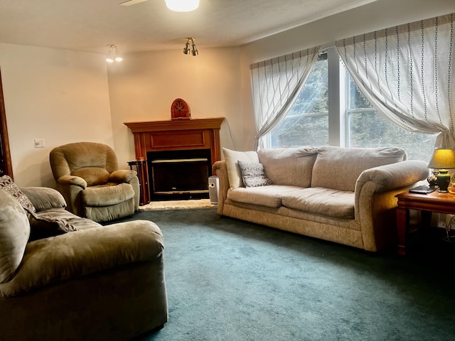 carpeted living area featuring a fireplace