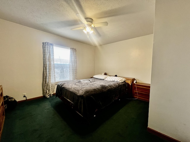 carpeted bedroom with ceiling fan, baseboards, and a textured ceiling