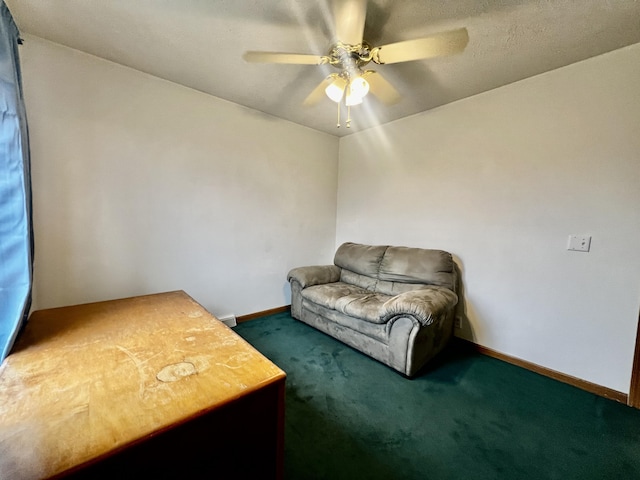 living area featuring carpet flooring, a ceiling fan, and baseboards