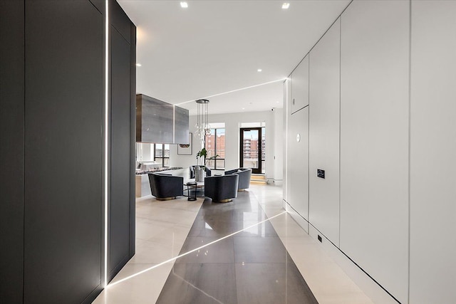 corridor with light tile patterned floors and recessed lighting