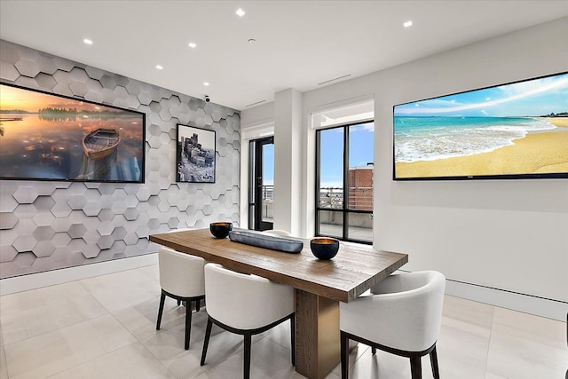 dining space with light tile patterned floors and recessed lighting