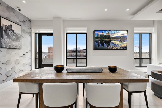 dining room with light tile patterned flooring, recessed lighting, and a healthy amount of sunlight