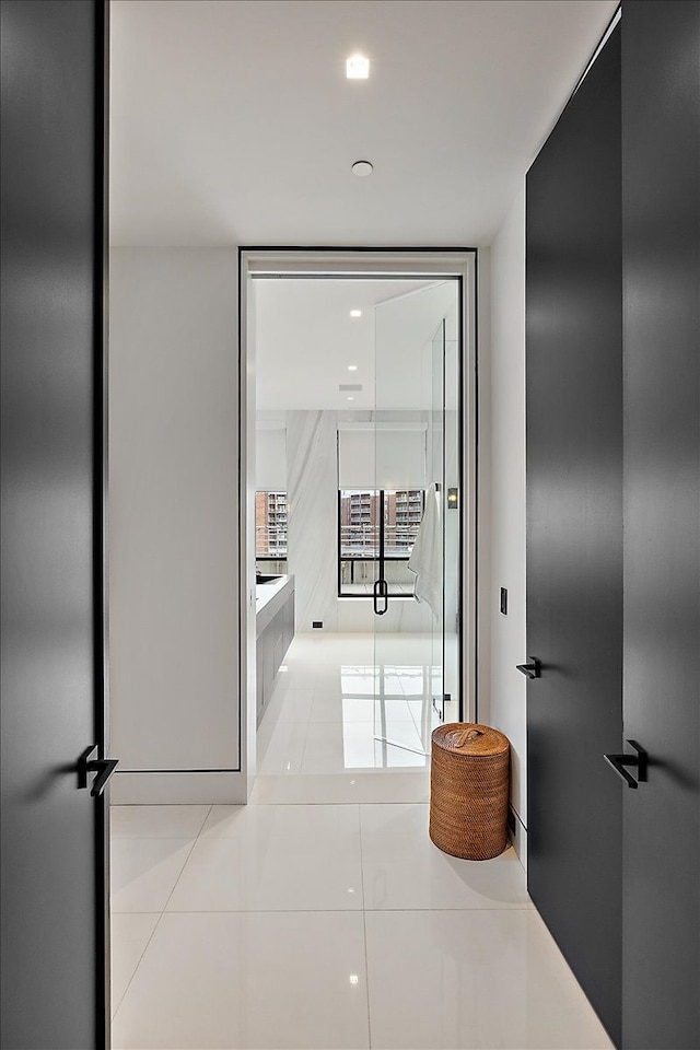 hallway featuring tile patterned flooring