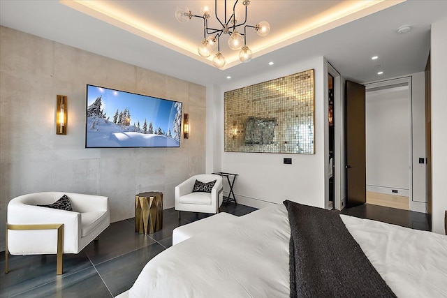 bedroom featuring recessed lighting, a tray ceiling, an inviting chandelier, and tile patterned flooring