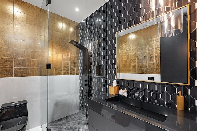 bathroom featuring backsplash, a shower stall, and tile walls