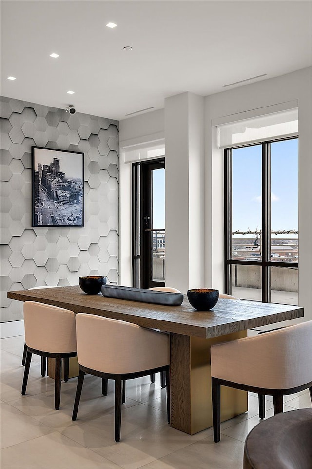 dining area with light tile patterned floors and recessed lighting