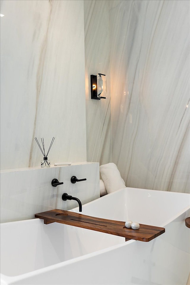 bathroom with a soaking tub