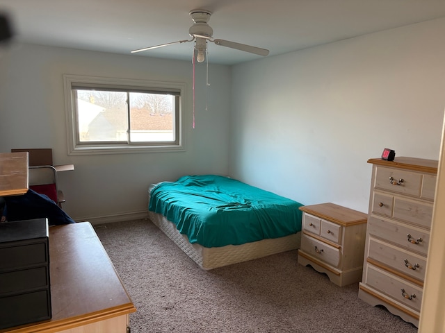 bedroom featuring carpet flooring, baseboards, and a ceiling fan