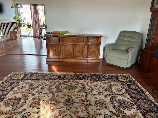 living area featuring dark wood-style floors