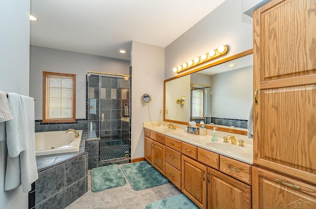 bathroom featuring double vanity, a sink, a shower stall, tile patterned flooring, and a whirlpool tub