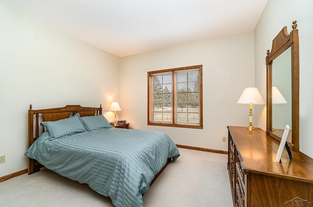 bedroom featuring light carpet and baseboards