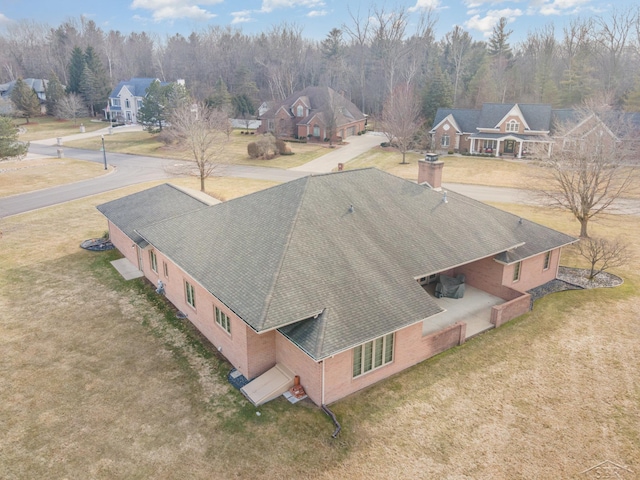 birds eye view of property with a residential view