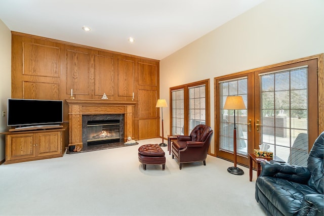 living area featuring a fireplace, carpet flooring, and recessed lighting