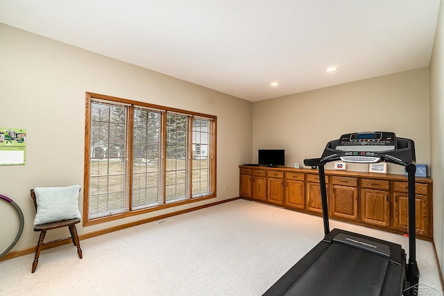 exercise room with light carpet, recessed lighting, and baseboards