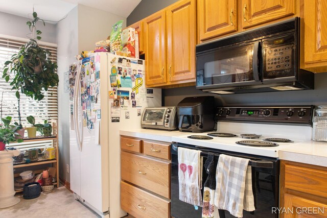 kitchen with a toaster, light countertops, white fridge with ice dispenser, range with electric cooktop, and black microwave