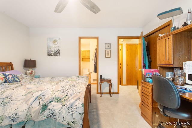 bedroom featuring a ceiling fan, light colored carpet, and baseboards