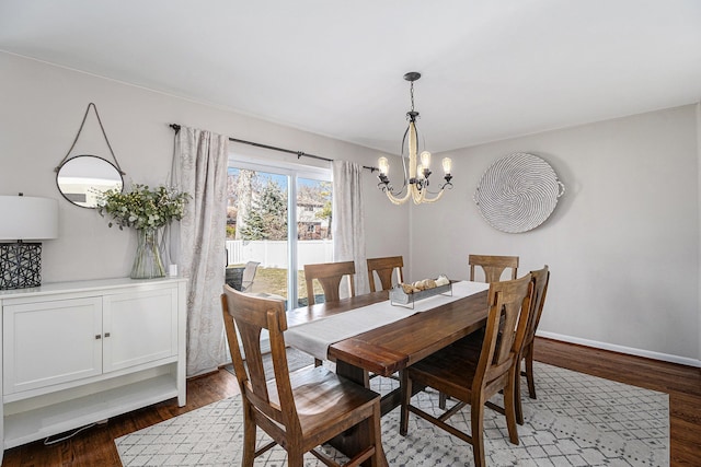 dining room with an inviting chandelier, wood finished floors, and baseboards