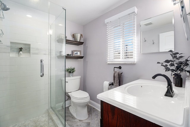 full bath with visible vents, toilet, a stall shower, and vanity