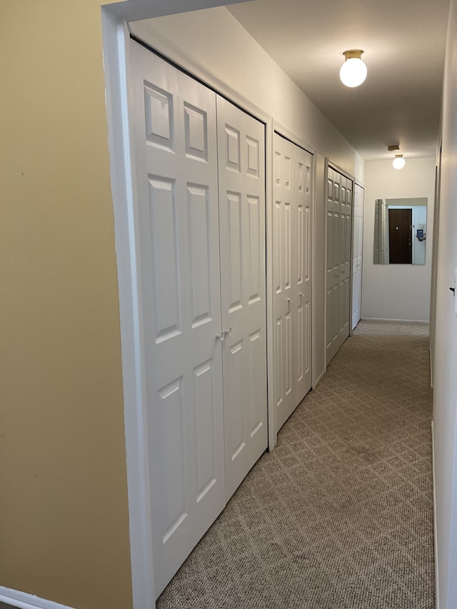 corridor with carpet floors