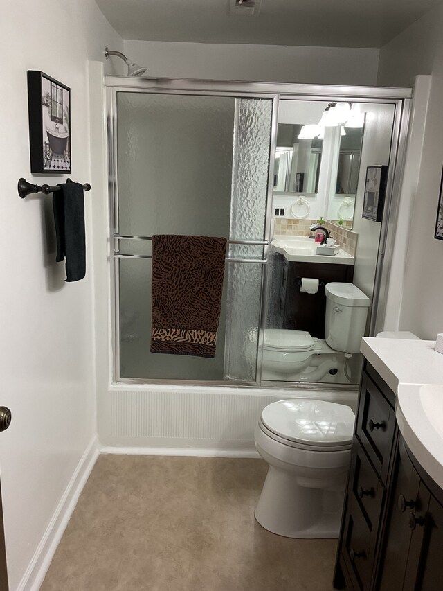 bathroom with toilet, baseboards, bath / shower combo with glass door, and vanity