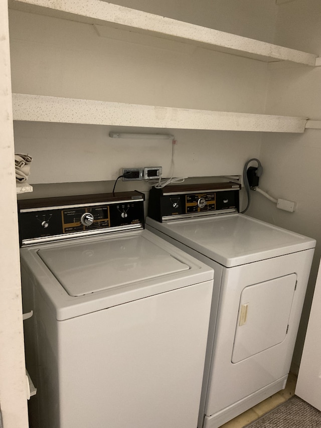 washroom featuring laundry area and independent washer and dryer