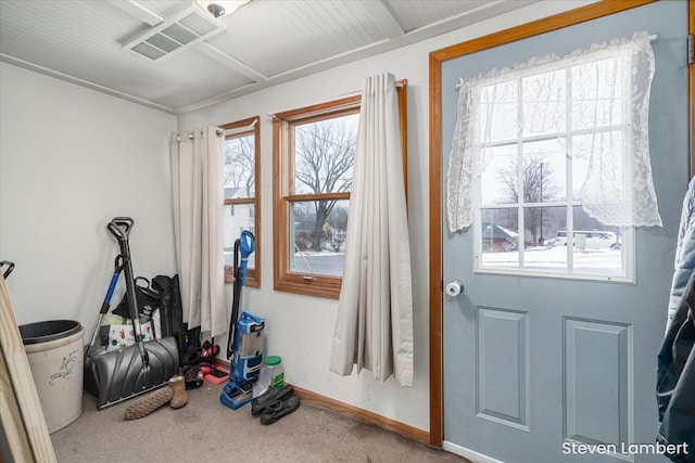 entryway featuring carpet, visible vents, and baseboards