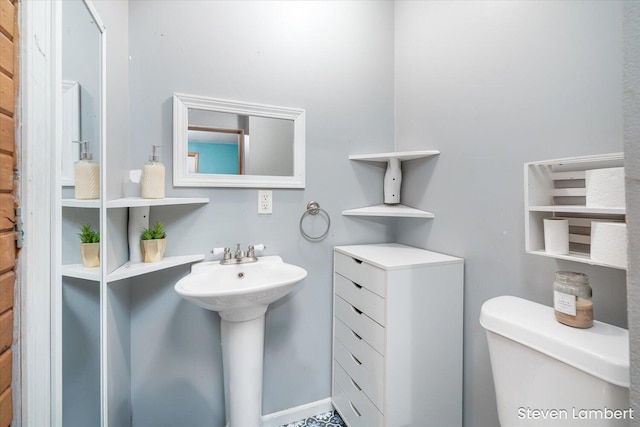 bathroom with a sink and toilet