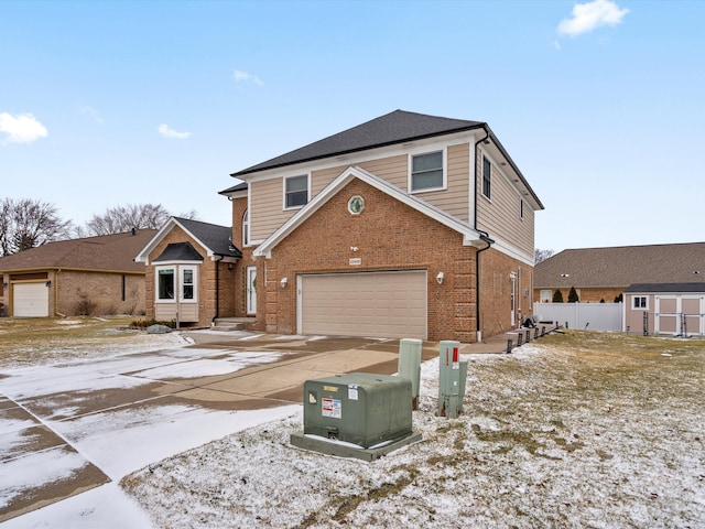 view of front of home with a garage, brick siding, driveway, and a storage shed