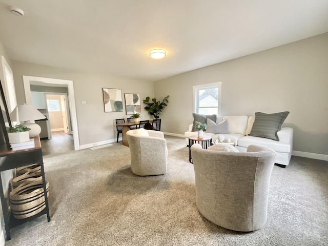 living room with carpet floors and baseboards