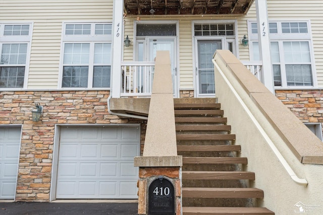 view of exterior entry featuring stone siding