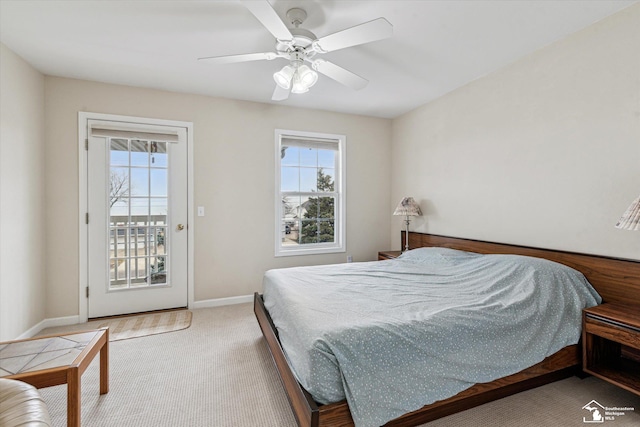 bedroom featuring access to exterior, carpet floors, multiple windows, and baseboards