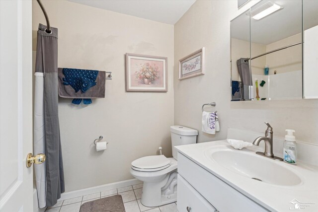 bathroom with toilet, tile patterned floors, vanity, baseboards, and a shower with curtain