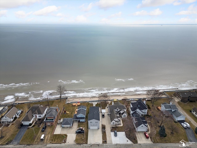 birds eye view of property with a water view and a residential view