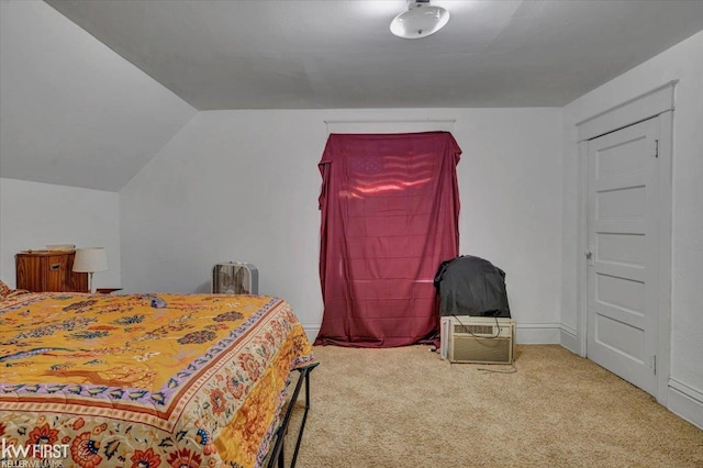 carpeted bedroom featuring lofted ceiling