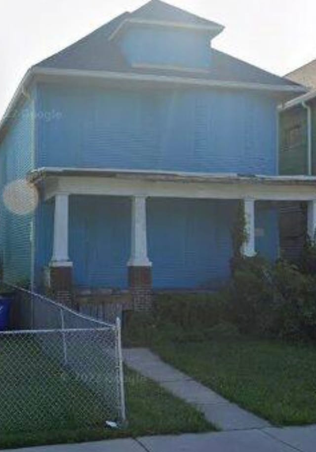 view of front of house with fence