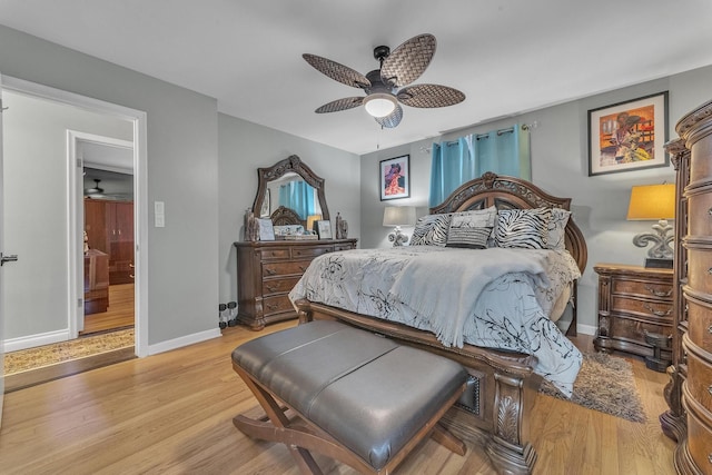 bedroom with light wood-type flooring, baseboards, and ceiling fan