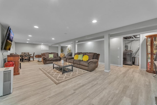 living area featuring recessed lighting, wood finished floors, and baseboards