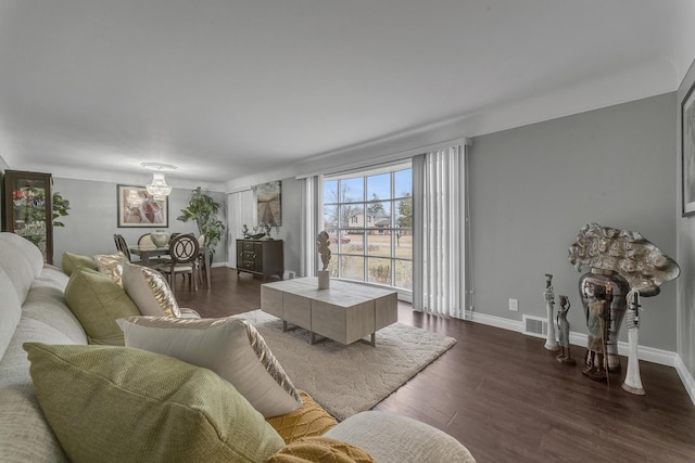 living room featuring baseboards, visible vents, and dark wood-style flooring