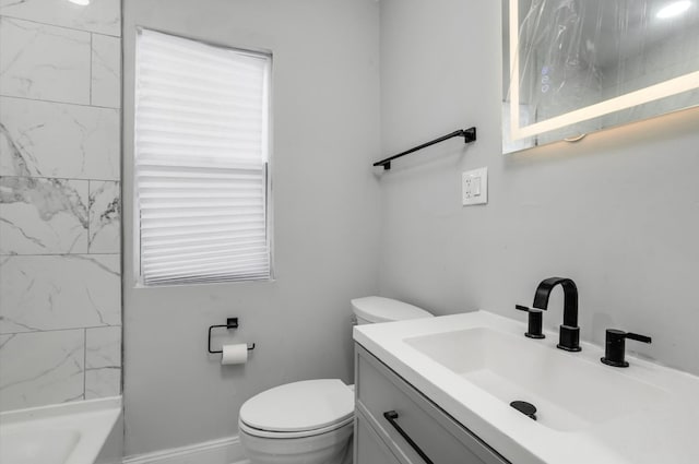 bathroom featuring baseboards, vanity, toilet, and tub / shower combination