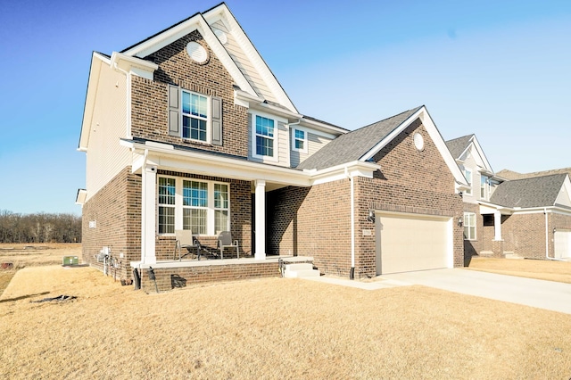 view of front facade with brick siding, covered porch, and concrete driveway