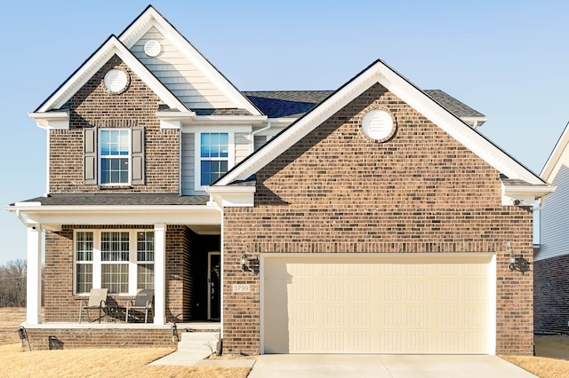 view of front of property featuring concrete driveway, a garage, brick siding, and covered porch